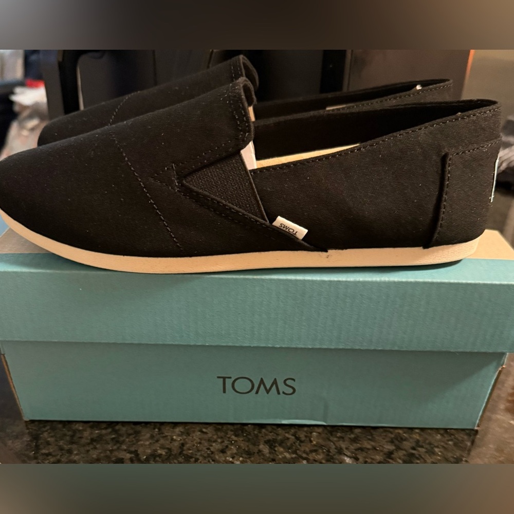 TOMS Women’s Black Canvas Slip-Ons